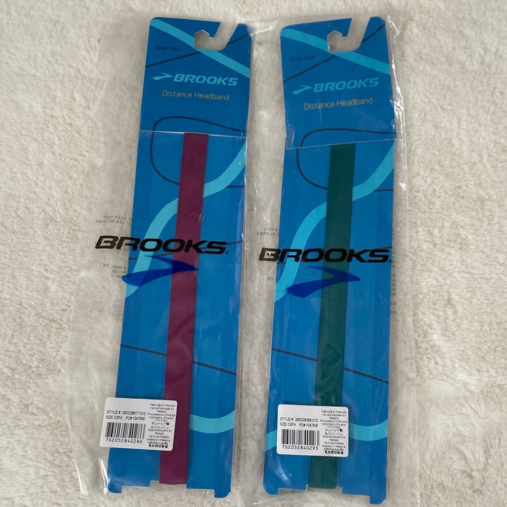 2 Brooks Adjustable Distance Headbands NWOT.  One Purple. One Forest Green.